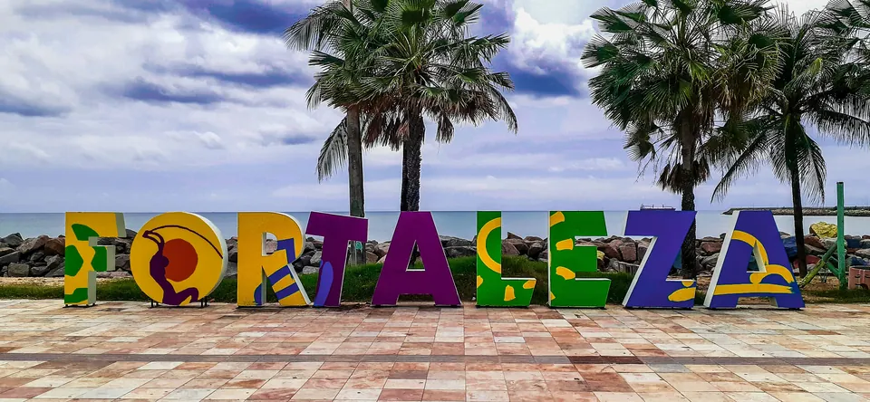 Colorful Fortaleza sign with palm trees behind it