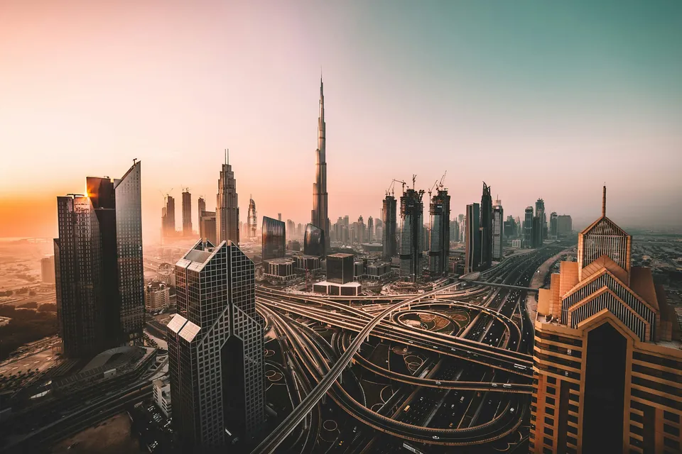 Dubai skyline and elevated roads at sunset