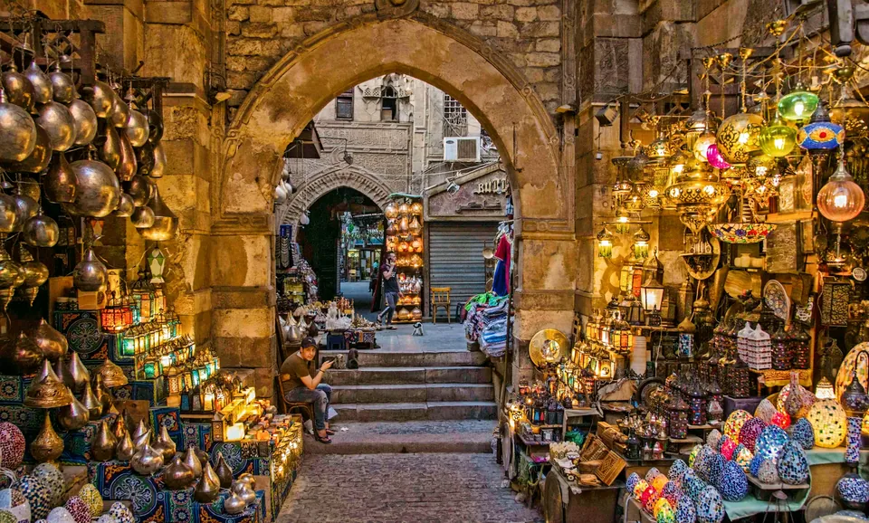 Lanterns and souvenirs displayed in an Egyptian market passage