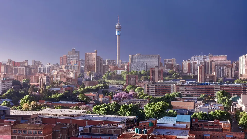 South African city skyline illuminated at dusk