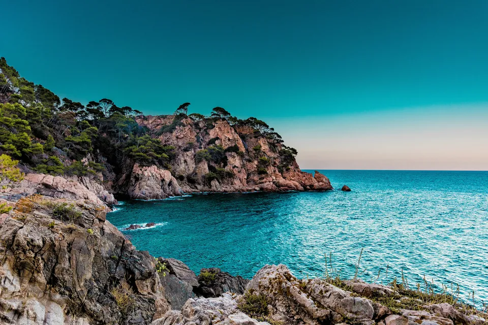 Rocky coastline and clear turquoise water in Spain