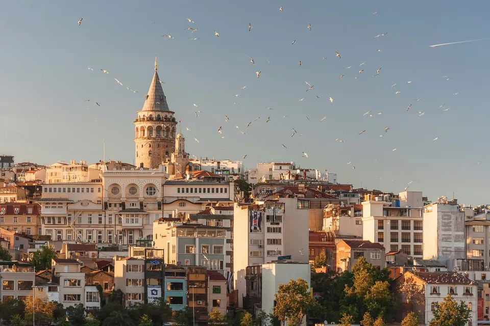 Stone tower rising above buildings in Istanbul